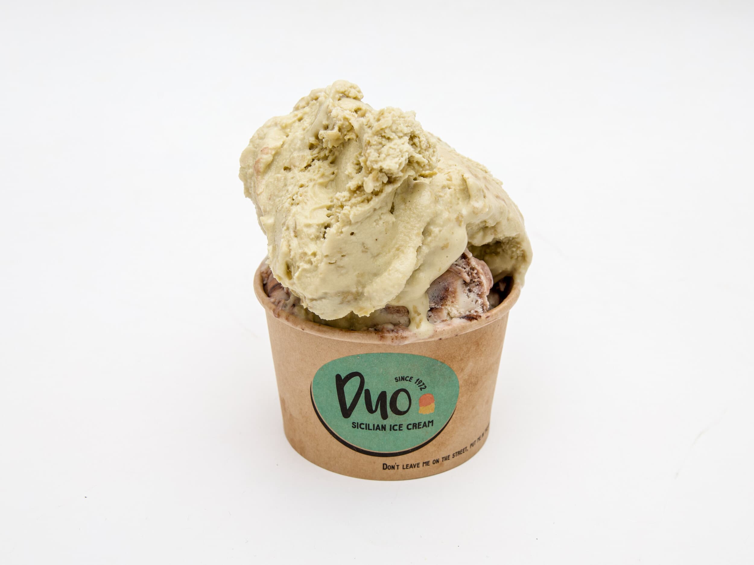 A cup of Duo Sicilian gelato with pistachio and amarene cherries